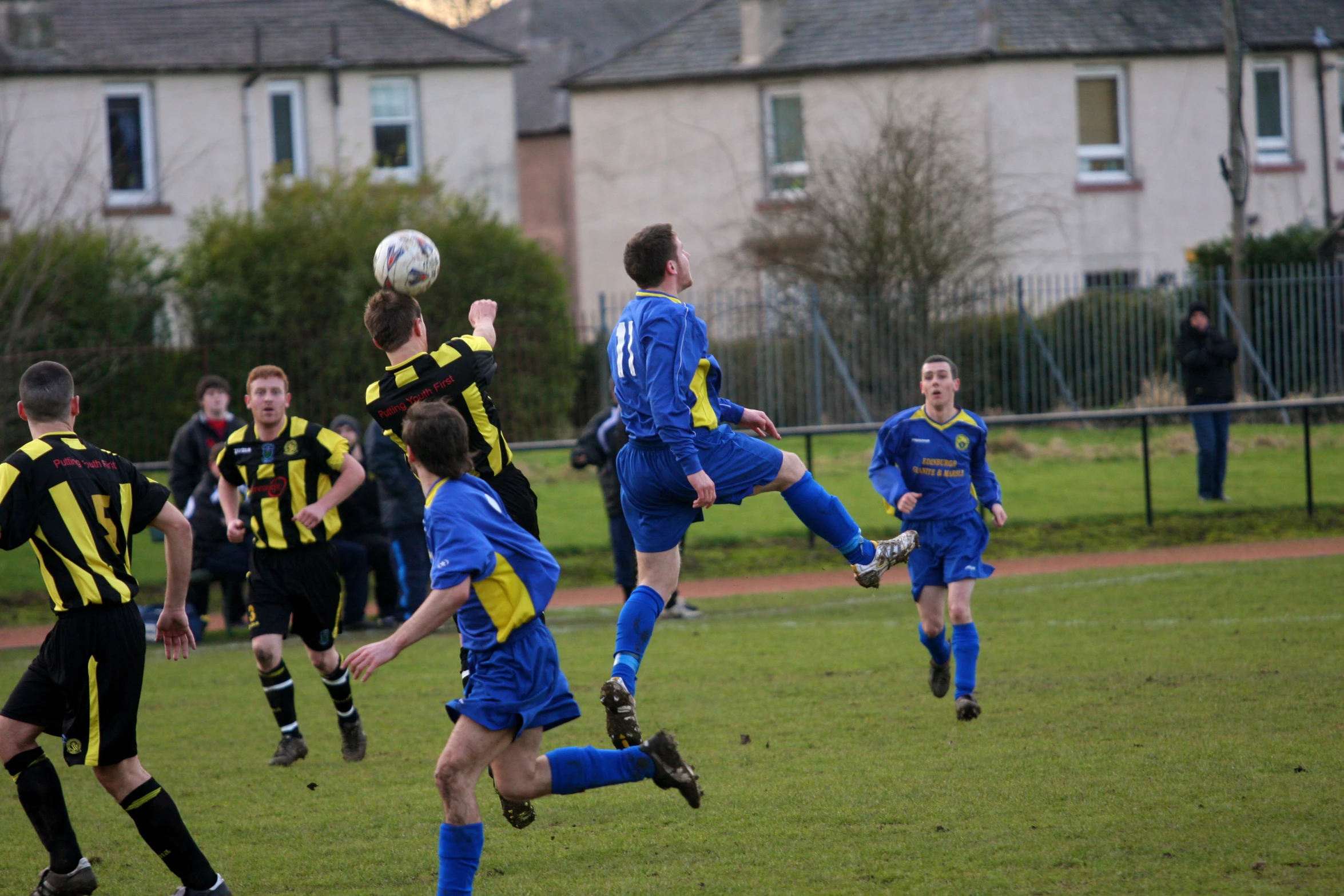 some soccer players are playing soccer on the field