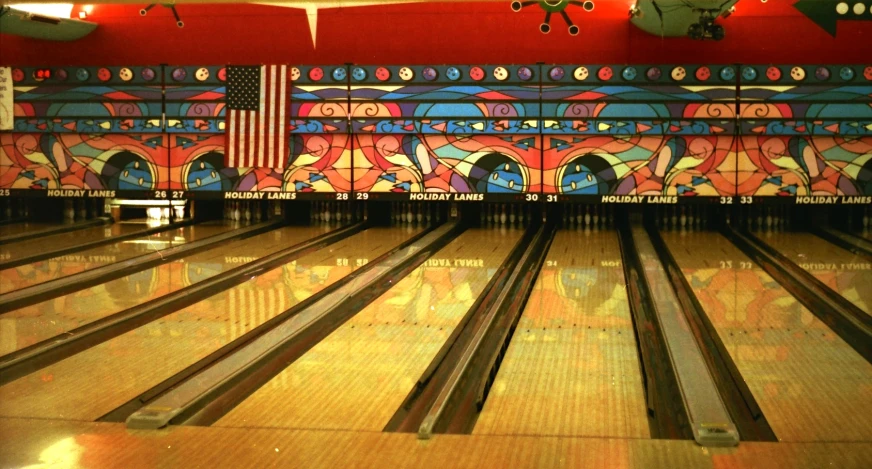 a bowling alley with red and blue walls