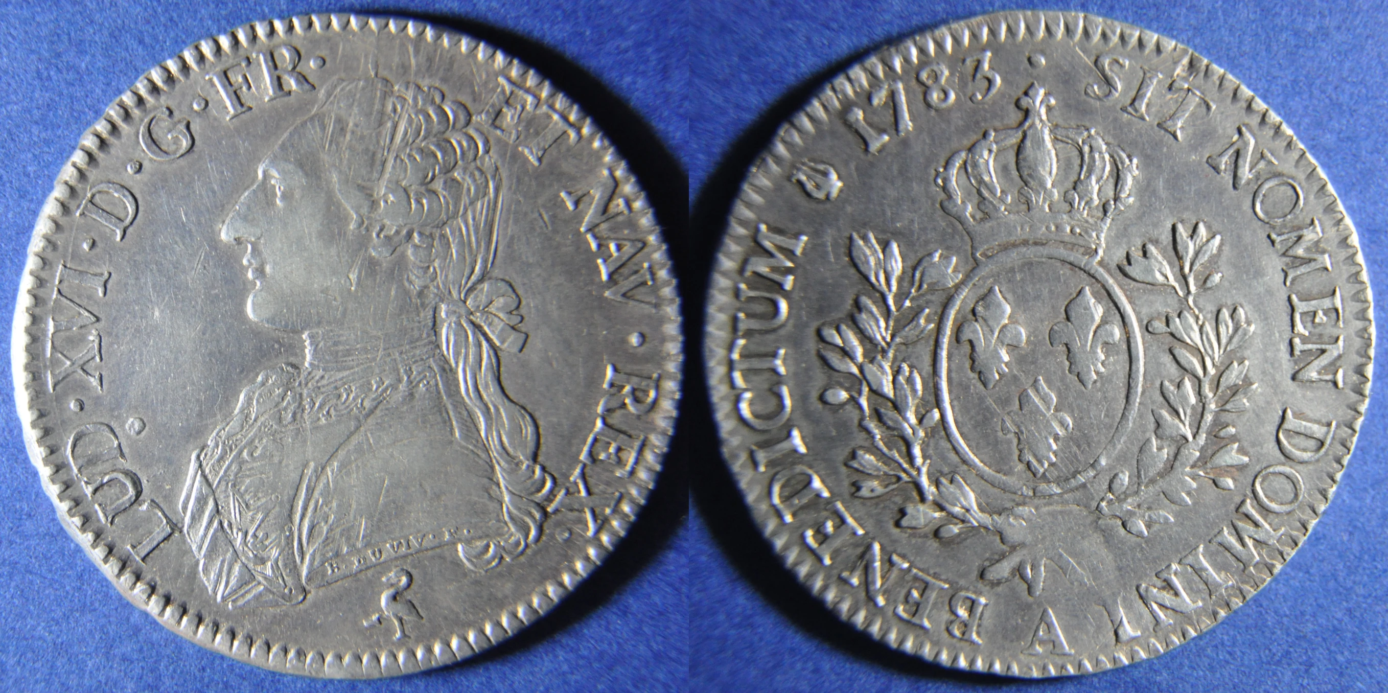 two coins of silver sitting side by side