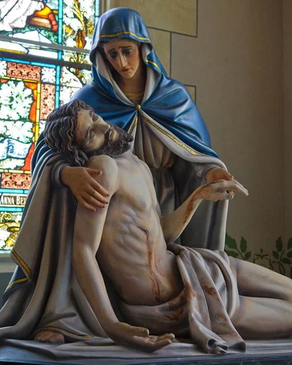 jesus is holding the body of another jesus