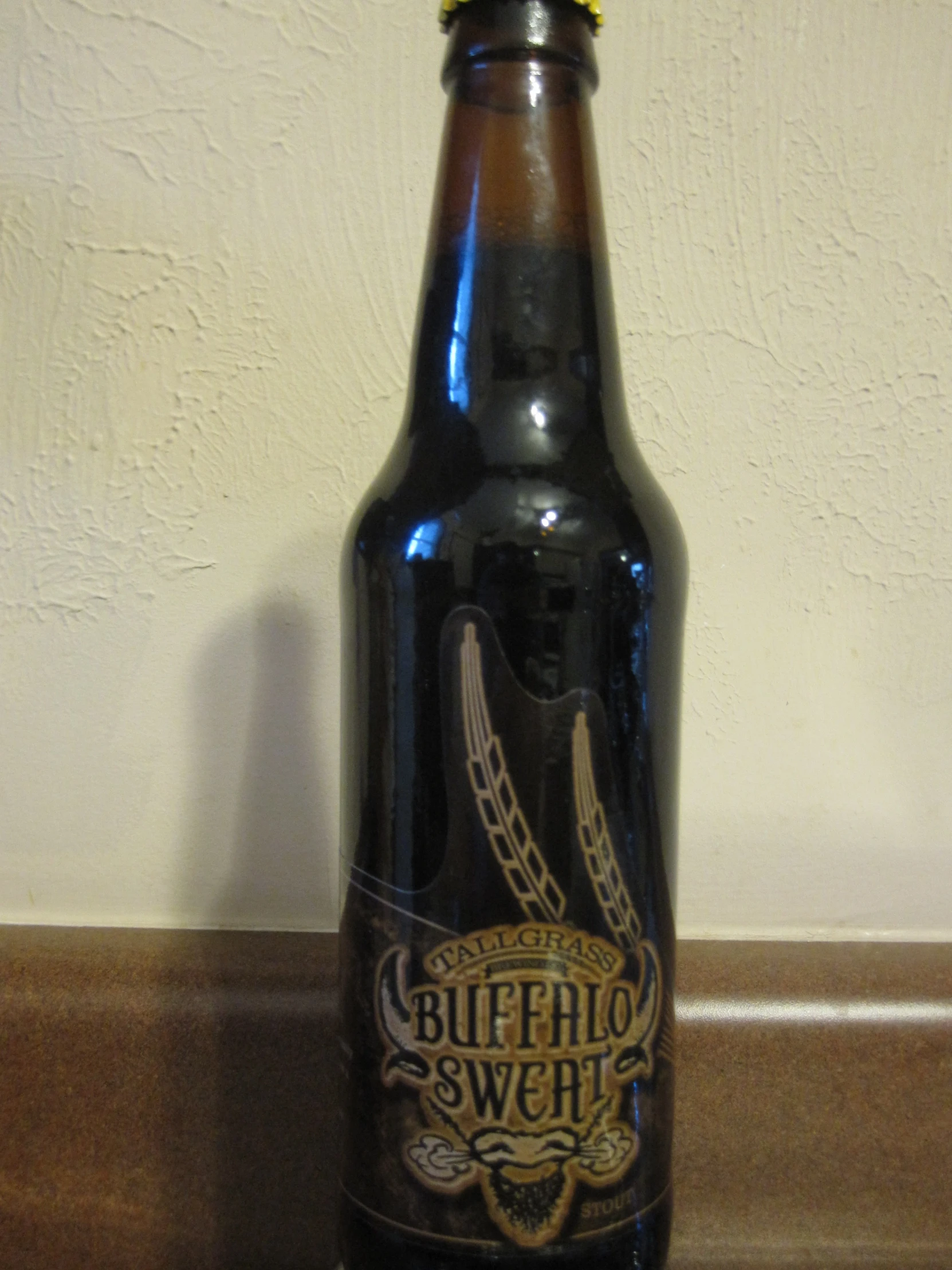 a beer bottle sitting on top of a counter