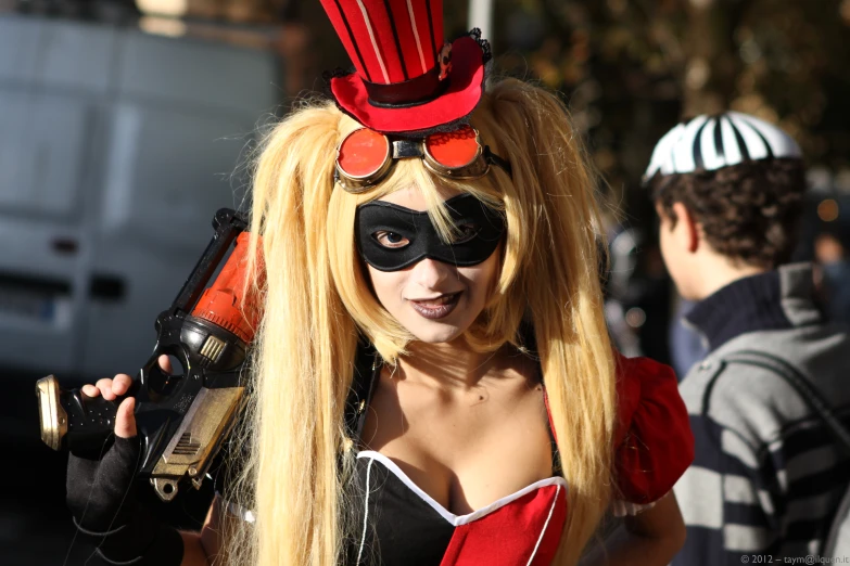 woman wearing costume and black mask with red hair