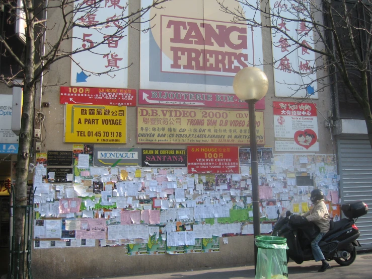 a store front with a large number of signs on the front