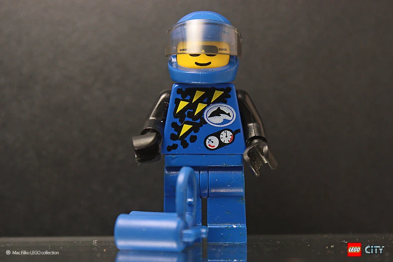 a blue lego minifigure with a helmet and goggles
