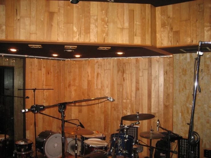 a room with some wooden paneling and instruments in it