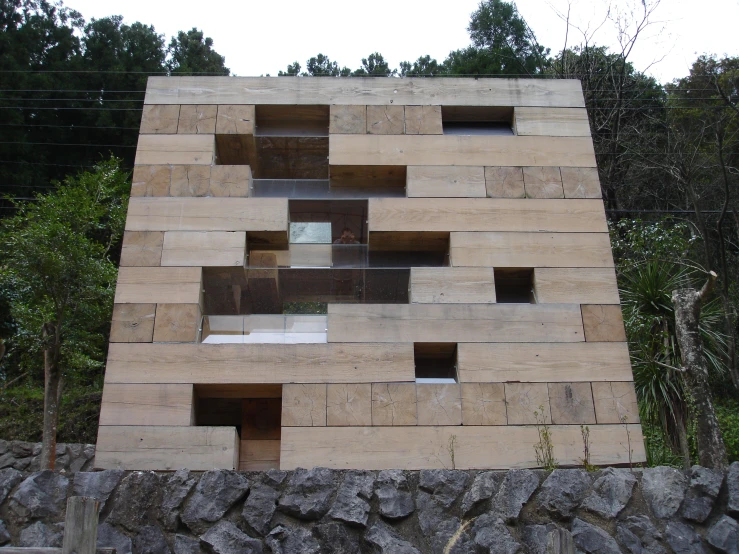 a stone wall with lots of windows in it