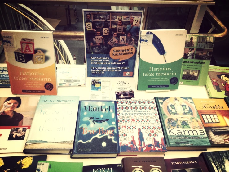 several books stacked together on top of a table