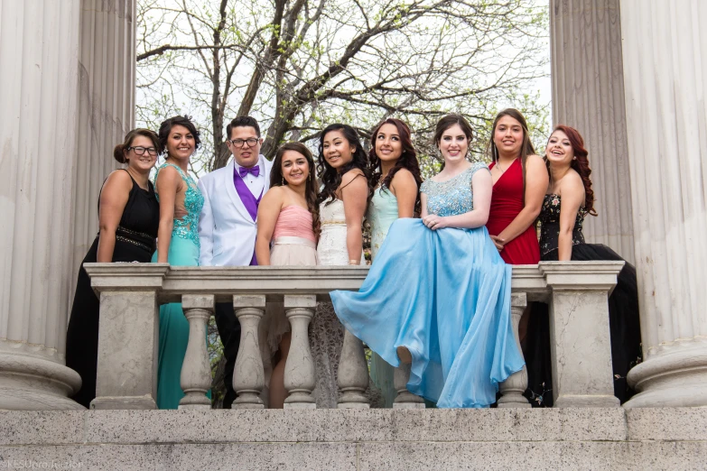 a group of beautiful young ladies sitting next to each other