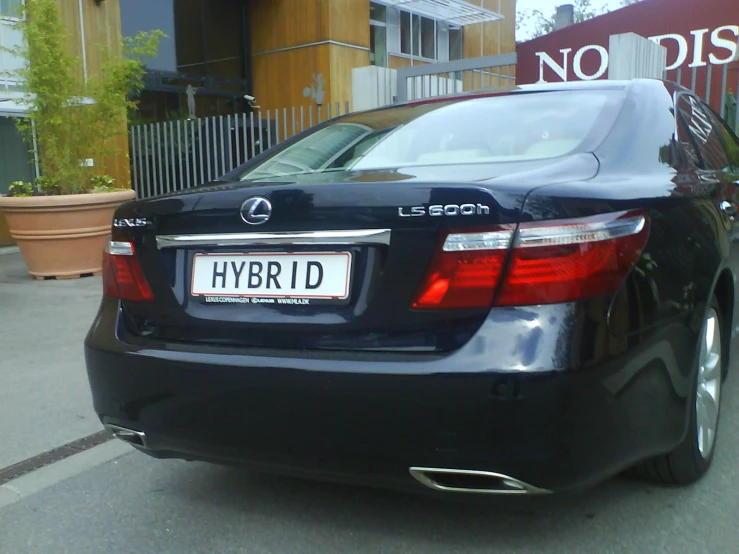 a black car parked outside a building