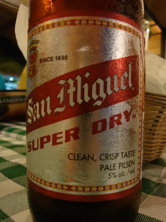 a brown beer bottle sitting on top of a table