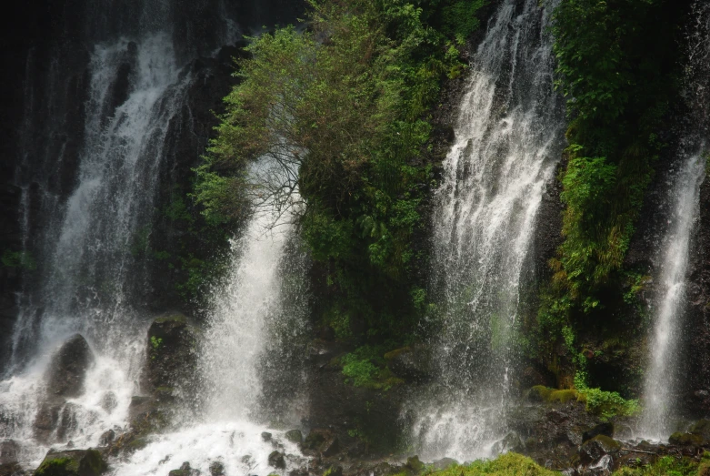 a waterfall with lots of water pouring over it