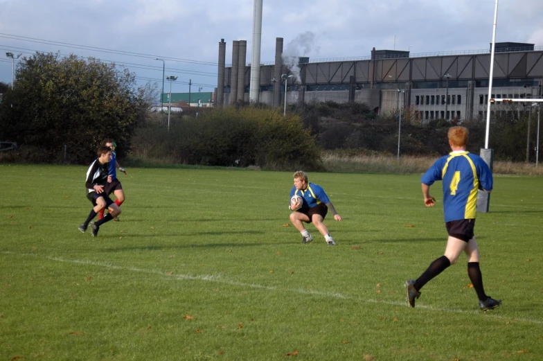 some soccer players playing a game on a field