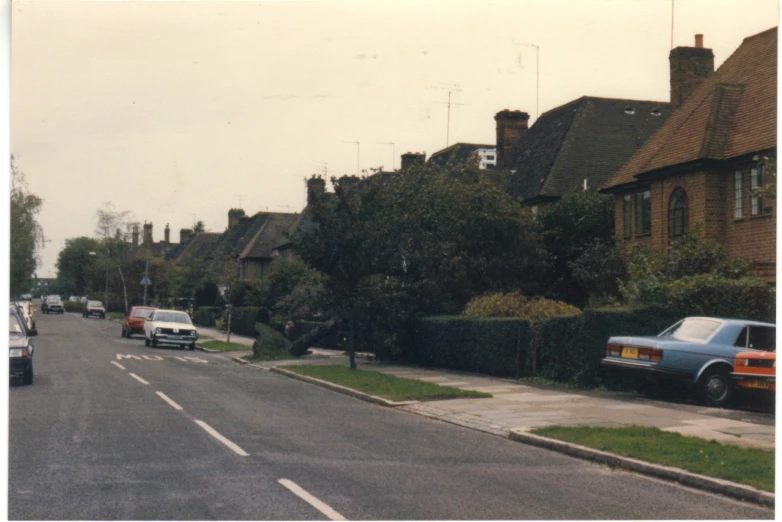 a road with residential houses on both sides