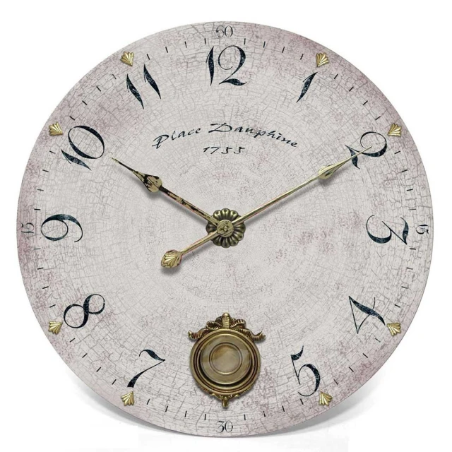 a fancy white clock with gold numbers on the face