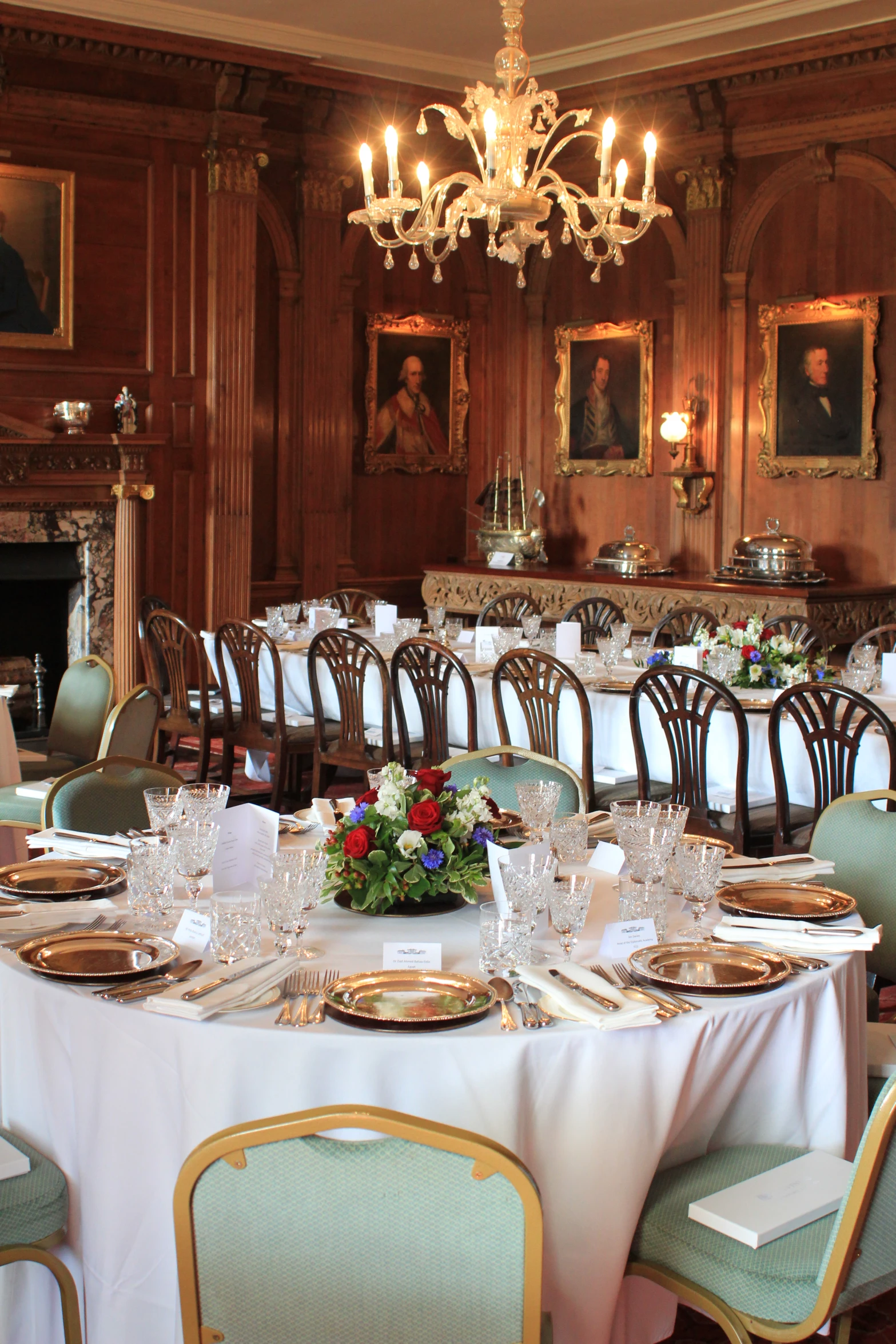 a fancy dining room with several dining tables