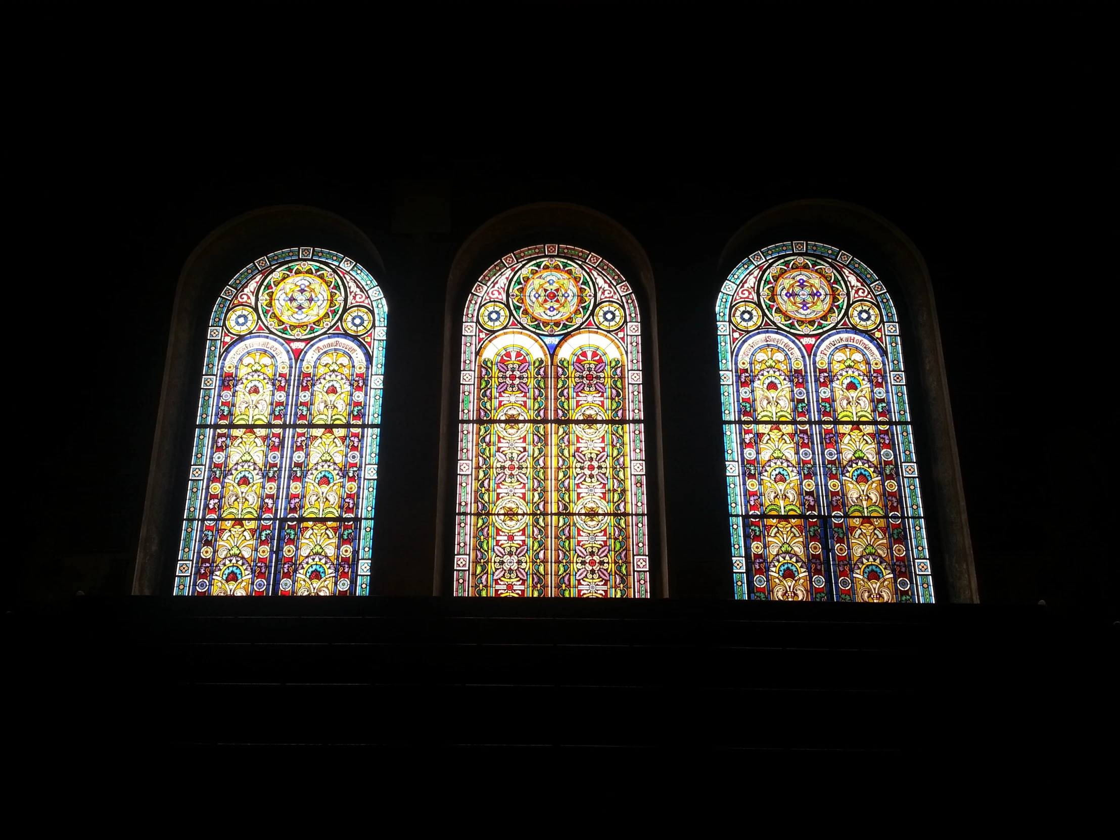 the stain of stained glass windows have dark colors