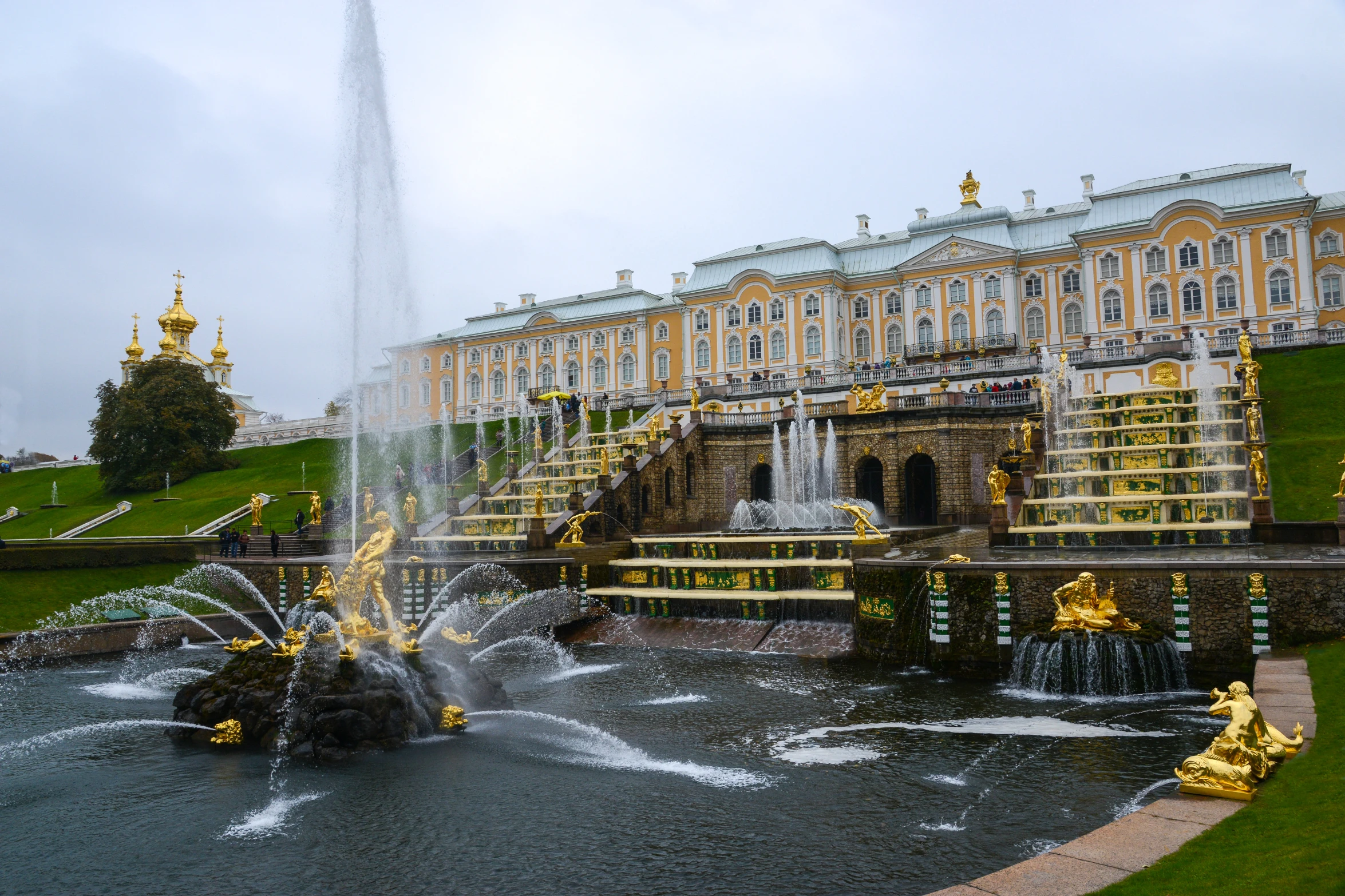 the fountain has yellow ornaments around it