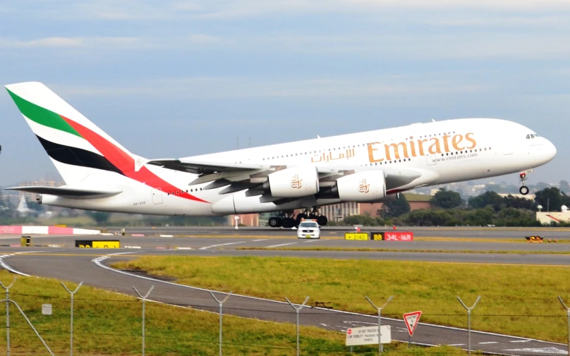 an emirates 747 passenger jet about to land