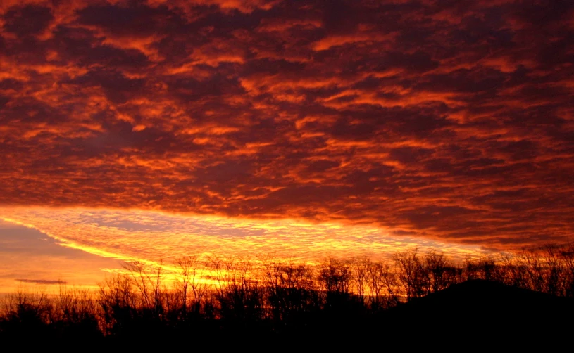 a beautiful sunset taken from a hillside on a clear day