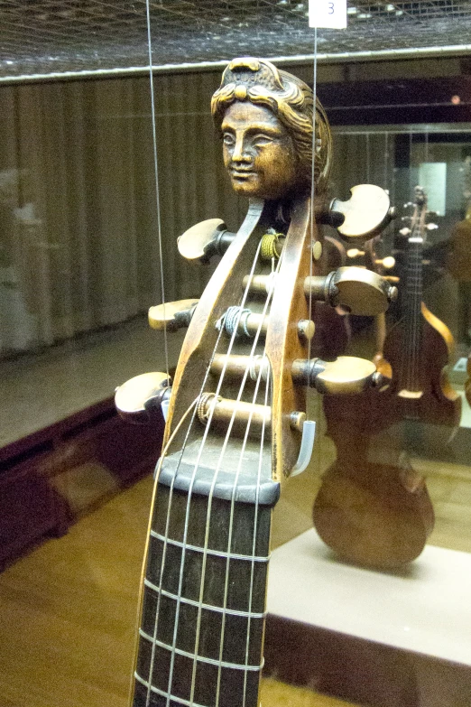 a close up of a statue of a guitar