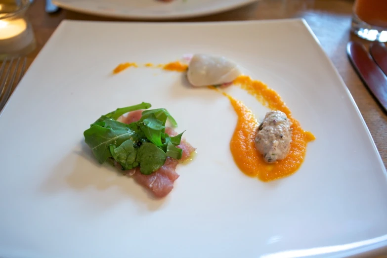 a small plate with various food items on it