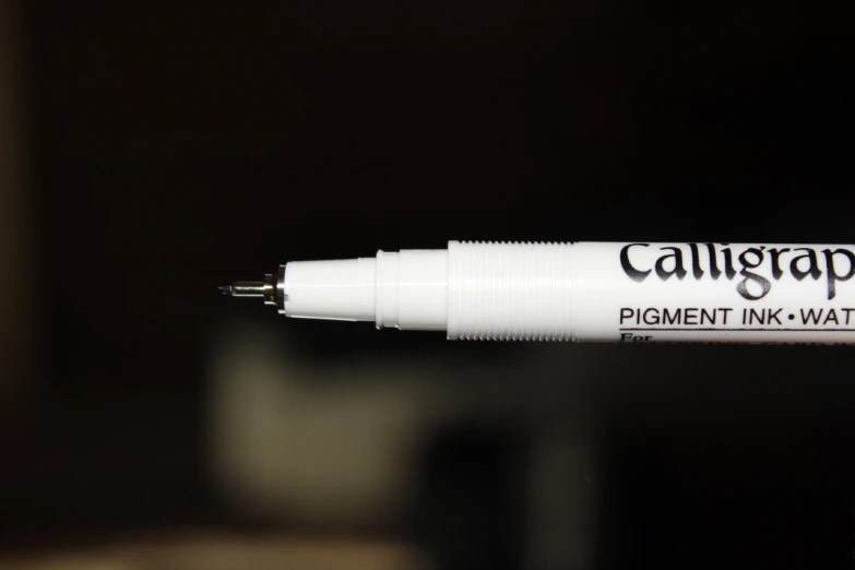 a black and white picture of a pen