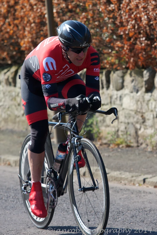 a cyclist riding on a road in the city