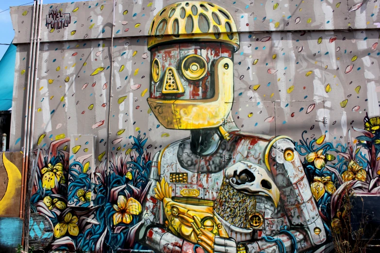 a yellow helmeted character painted on the side of a building