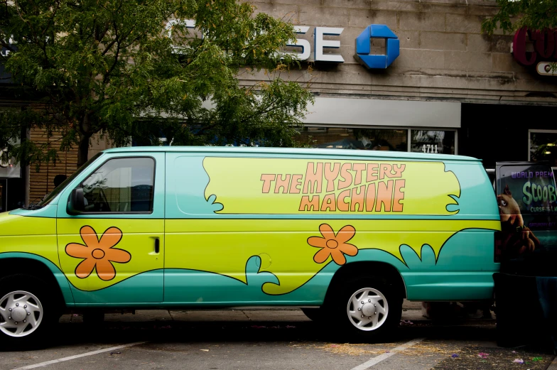 a colorful van is parked in a parking lot