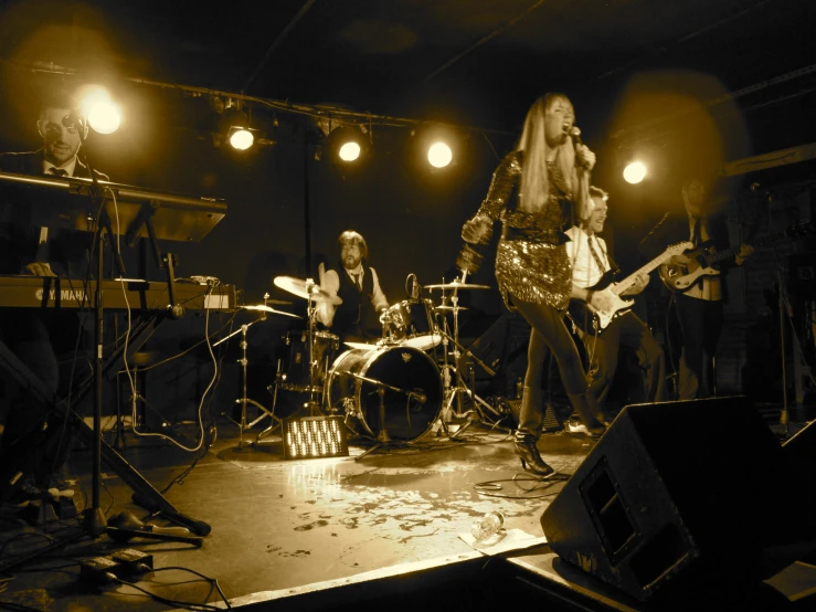 a black and white po of a woman playing music on stage