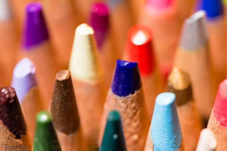 many colored pencils in a row together