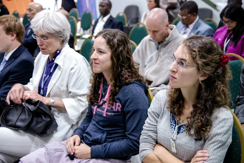 many people are seated in the audience at an event