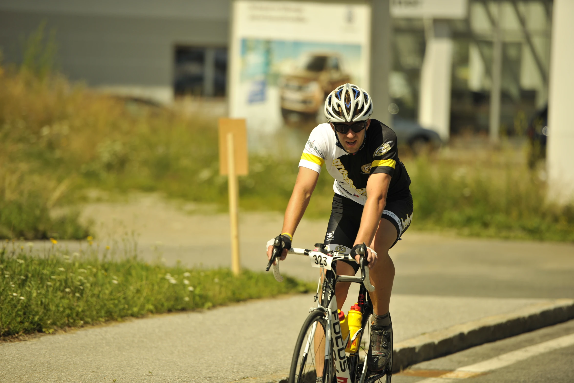 a man riding a bike down a street