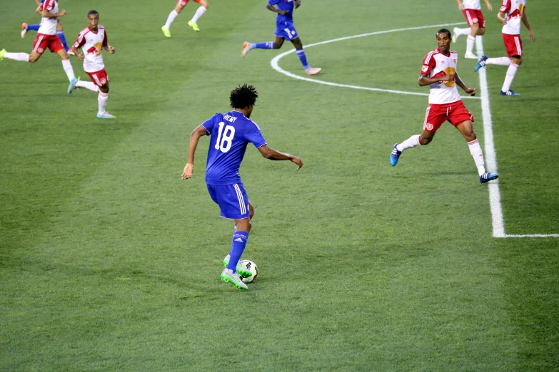 a group of people on a field playing soccer