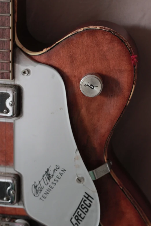 an electric guitar sitting inside of a case