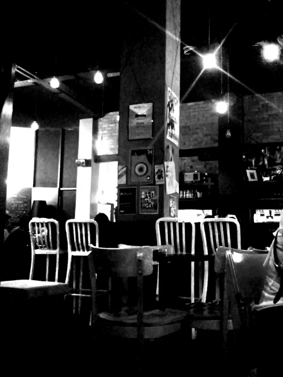 black and white image of two women sitting at a table