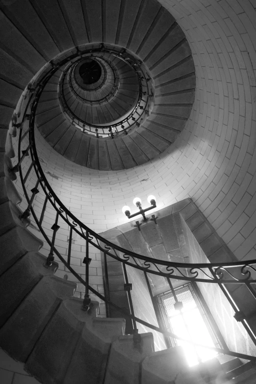 looking down the stairs at a church steeple