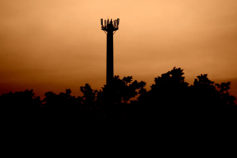 there is an image of an orange sky with an airplane