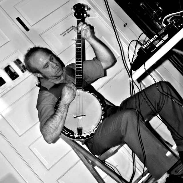 man playing the irish oar in black and white