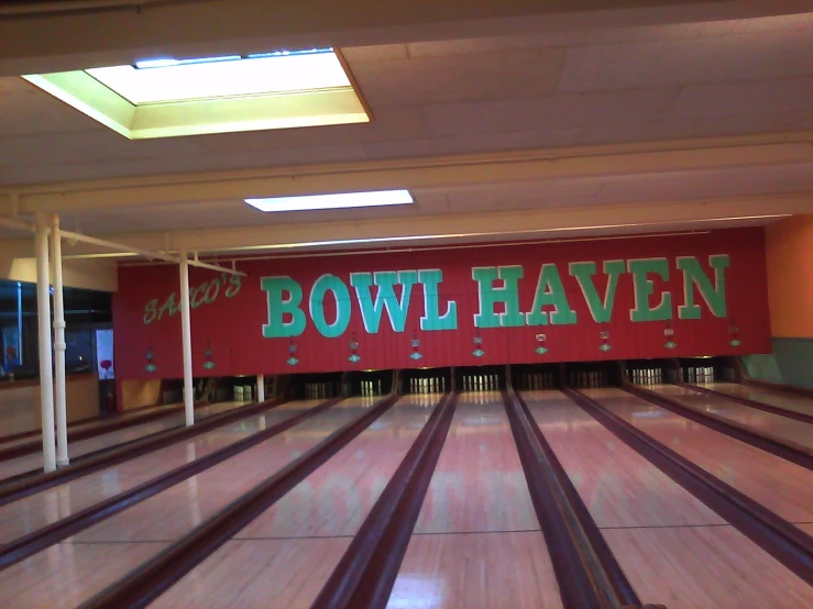 a bowling alley with some lanes that have bowling on it