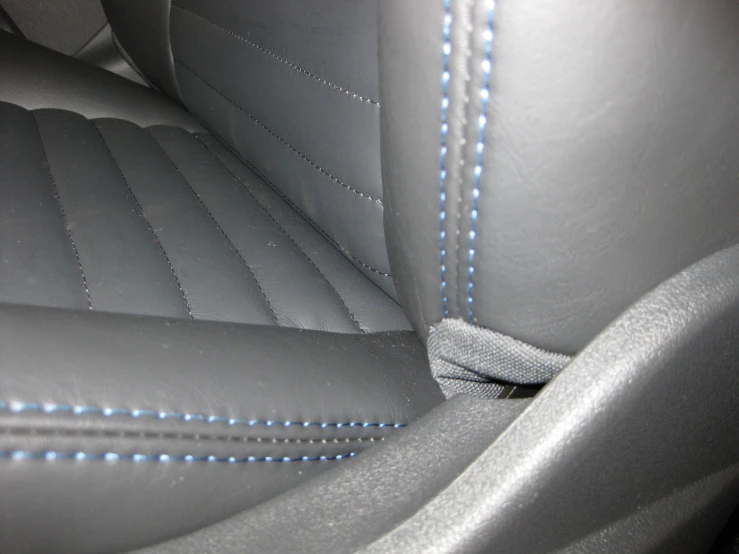 a close up of the stitchs on a seat covers