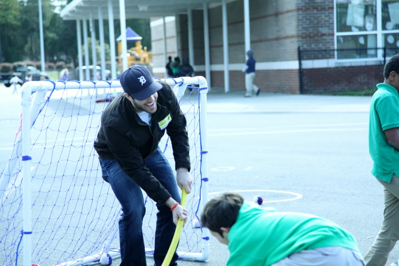 people playing with various toys and equipment in the park