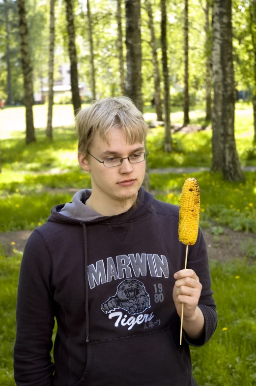 a young man with a weird looking toothpick