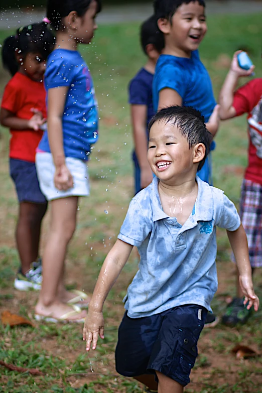 a group of children playing and laughing together