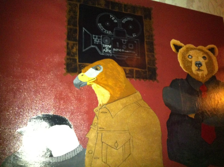 a mural depicting two bears on a red wall