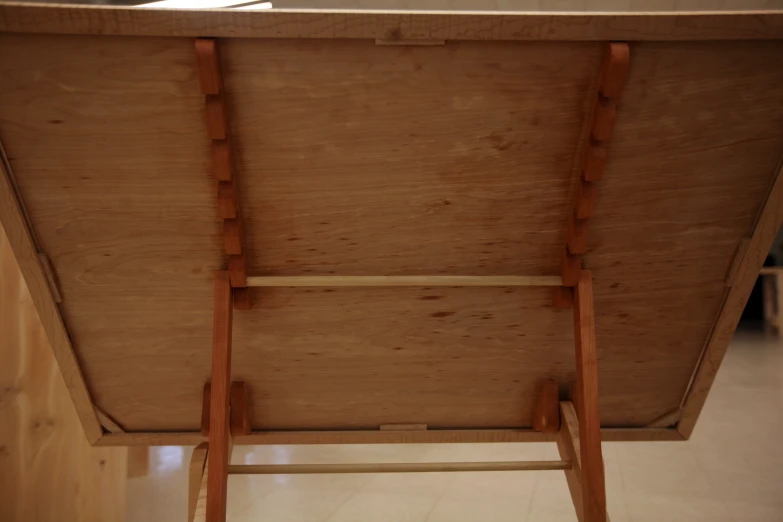 a close up of a table with a ladder attached