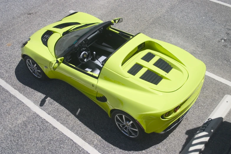 a car that has a flat roof sitting in a parking lot