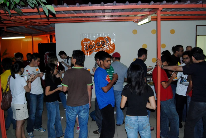 a group of people having drinks in a room