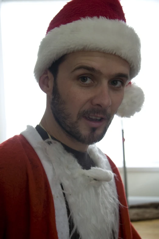 a man wearing a santa claus hat on his head