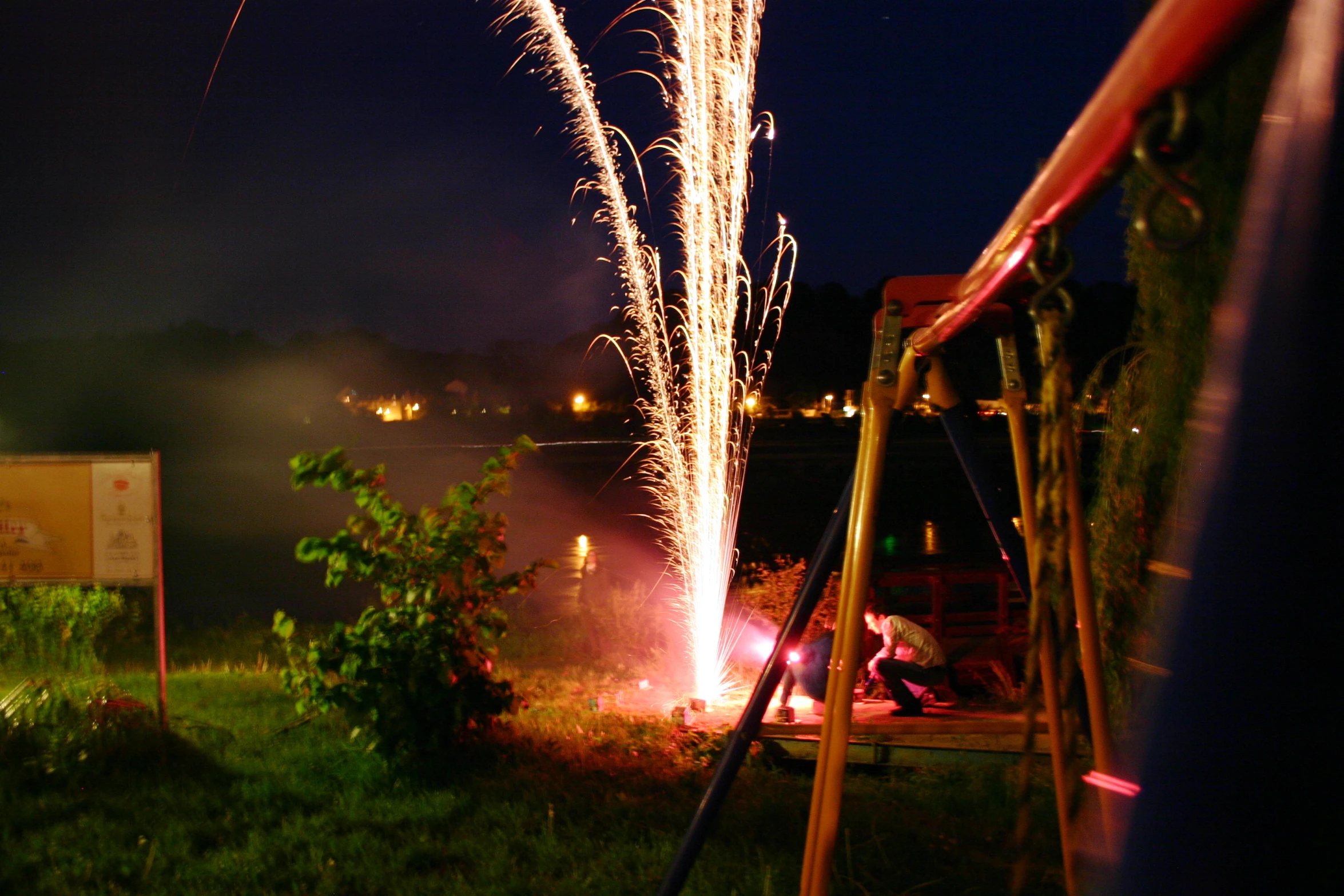 a bunch of fireworks are exploding off the hillside